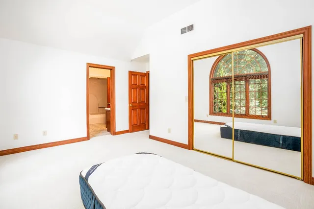 a view of an empty room with glass door