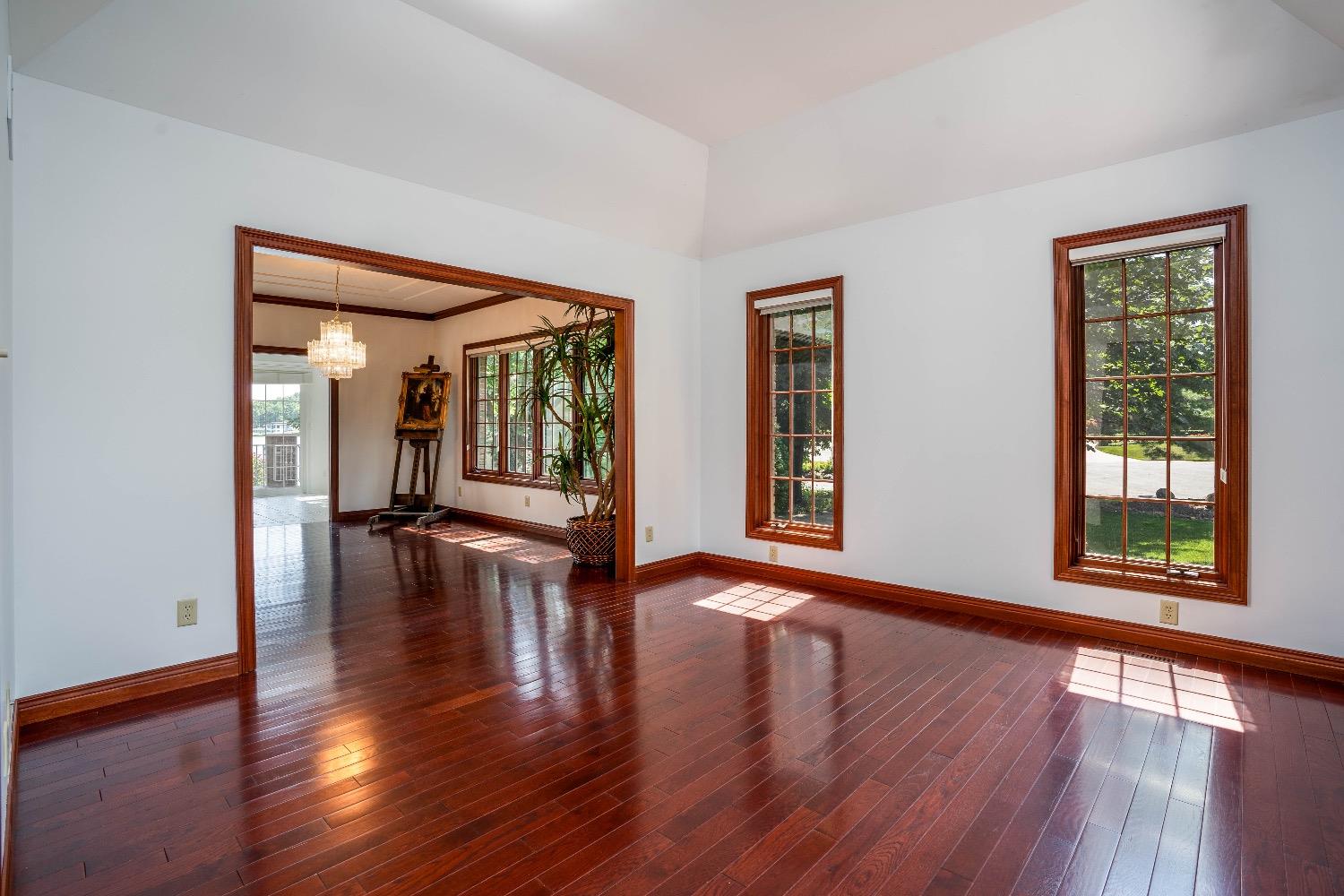 388 Deer Ridge Road Valparaiso, IN 46385 - Photo 2 of 35 a view of an empty room with wooden floor and a window