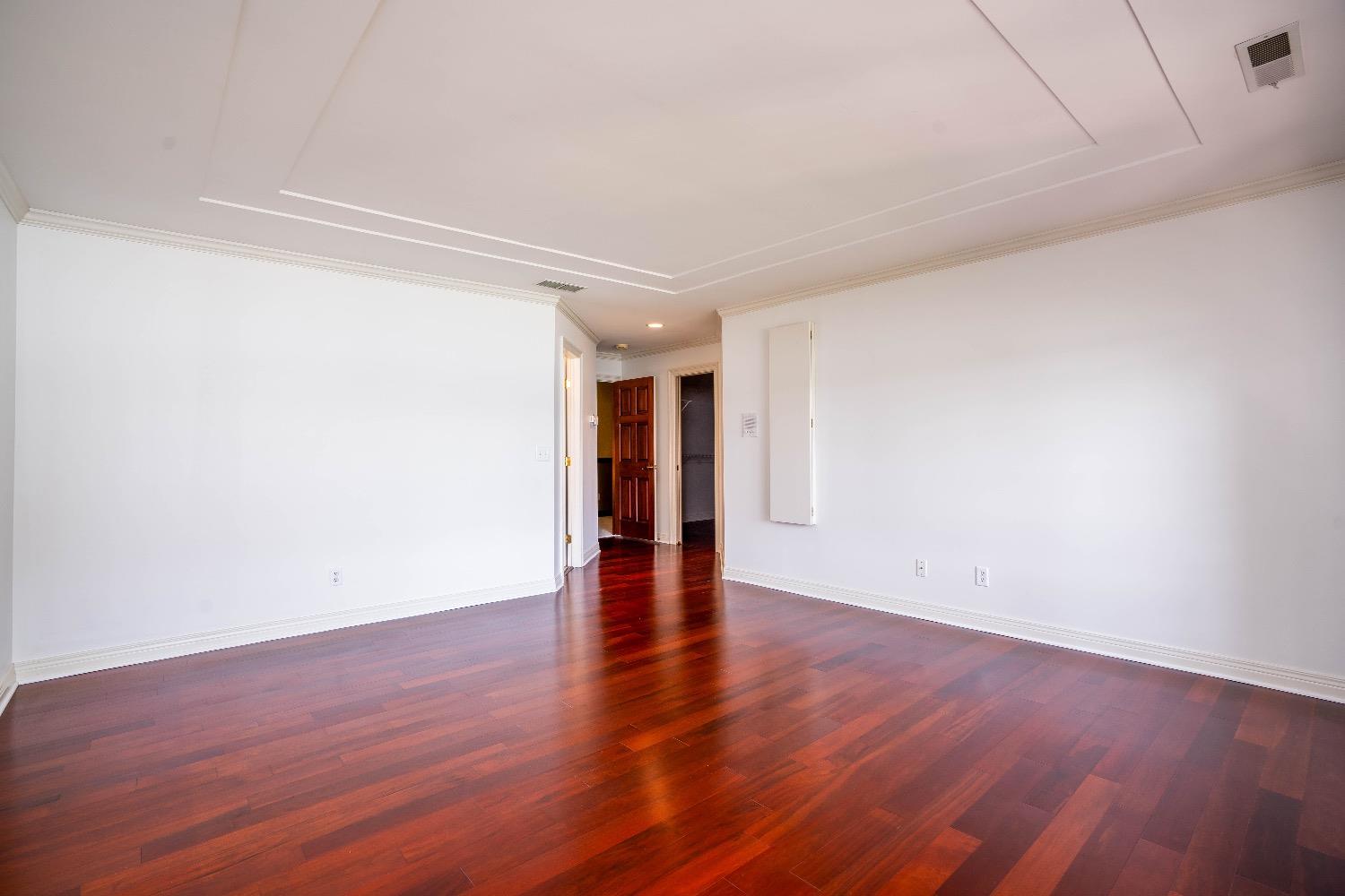 388 Deer Ridge Road Valparaiso, IN 46385 - Photo 23 of 35 a view of an empty room with wooden floor