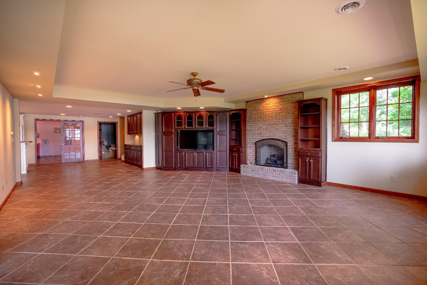 388 Deer Ridge Road Valparaiso, IN 46385 - Photo 28 of 35 a view of an empty room with window and a kitchen