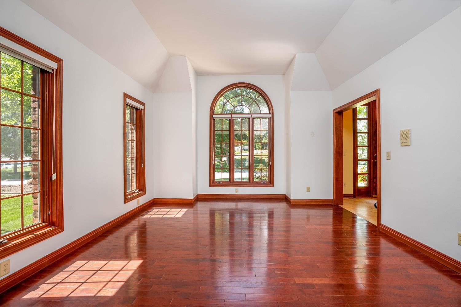388 Deer Ridge Road Valparaiso, IN 46385 - Photo 3 of 35 a view of an empty room with wooden floor and a window