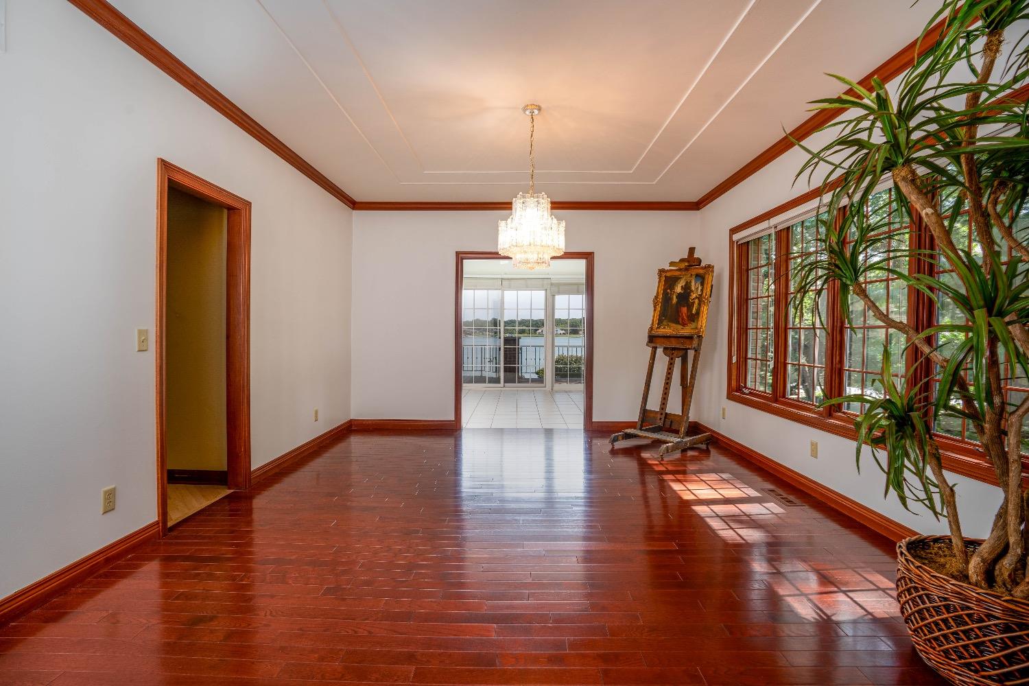 388 Deer Ridge Road Valparaiso, IN 46385 - Photo 4 of 35 a hallway with wooden floor chandelier and entryway