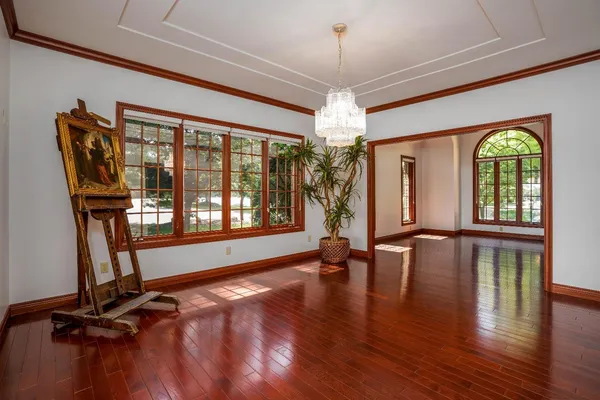 a view of an entryway with wooden floor
