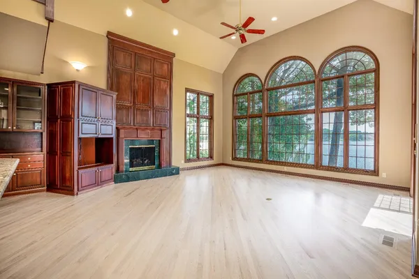 a view of livingroom with furniture wooden floor fan and window