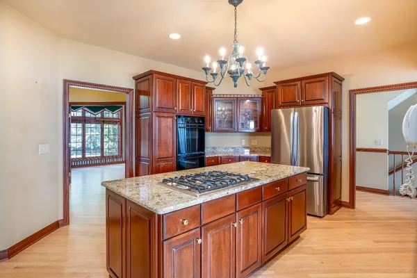 a very nice looking kitchen with a chandelier