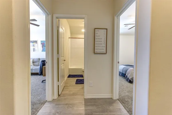 a bathroom with a tub and shower