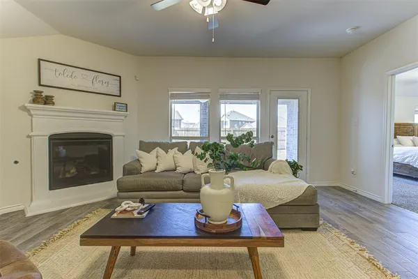 a living room with furniture and a fireplace