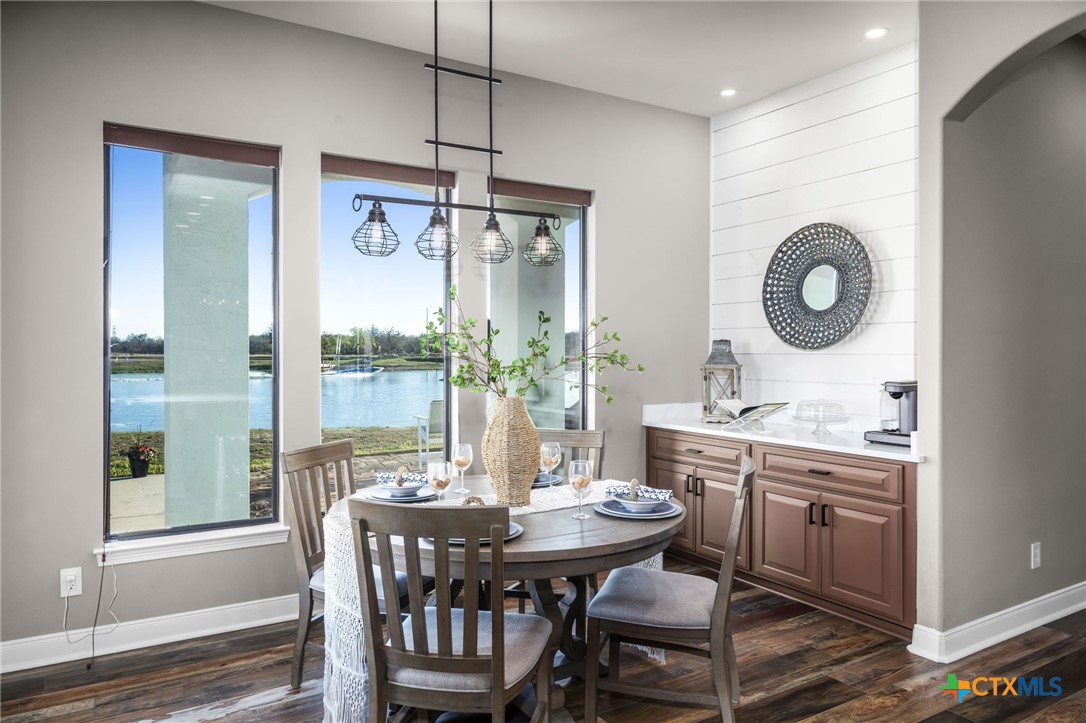 925 River Ranch Circle Martindale, TX 78655 - Photo 13 of 48 a view of a dining room with furniture window and wooden floor
