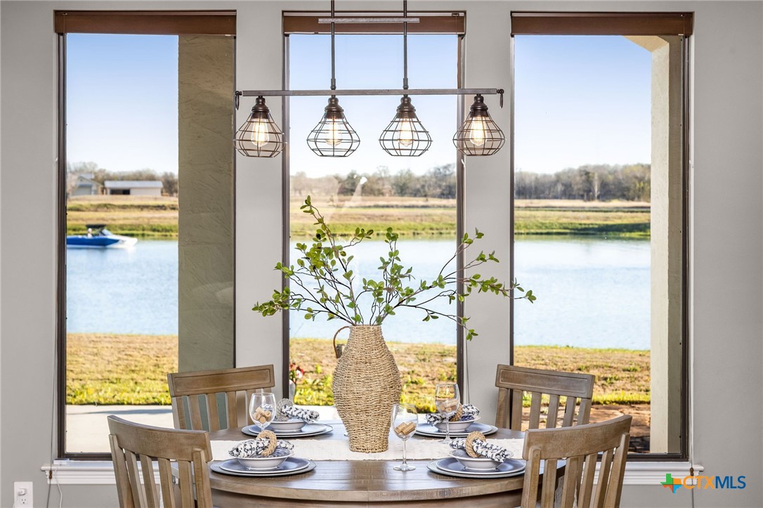 925 River Ranch Circle Martindale, TX 78655 - Photo 17 of 48 a view of a dining room with furniture window and outside view