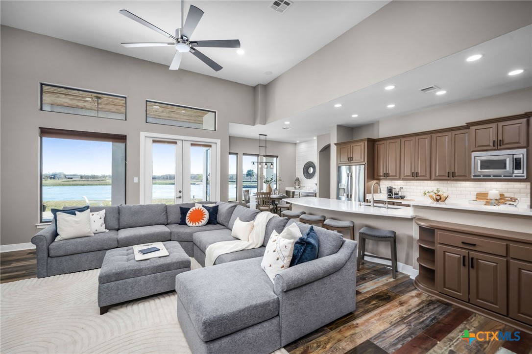 925 River Ranch Circle Martindale, TX 78655 - Photo 19 of 48 a living room with furniture kitchen view and a large window