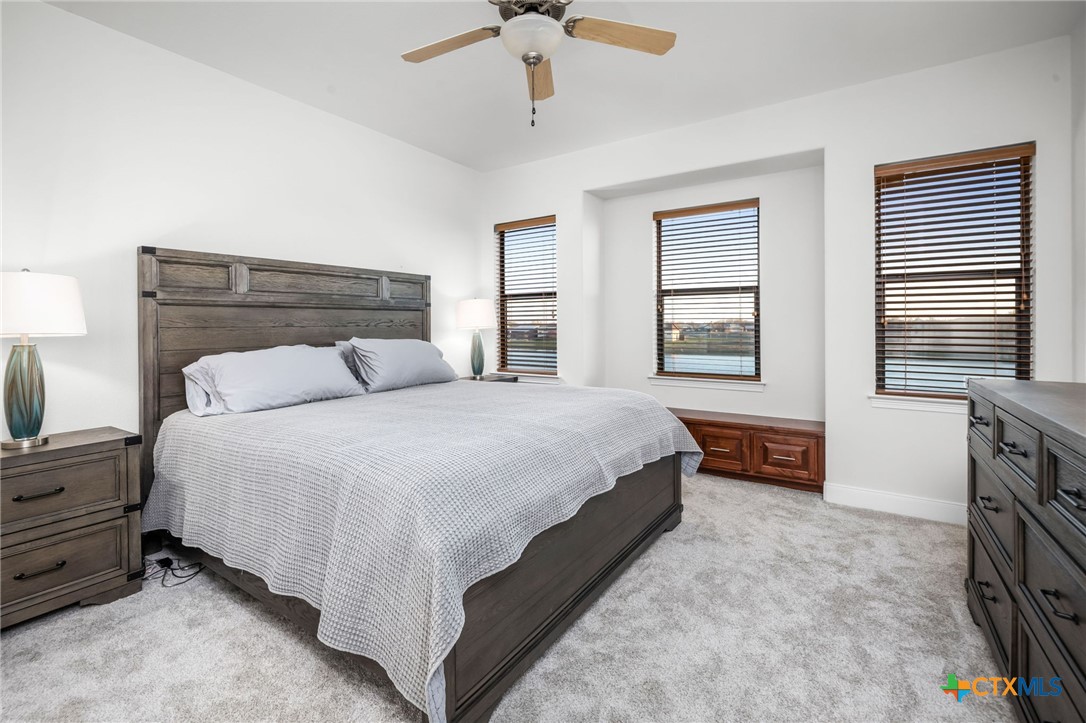 925 River Ranch Circle Martindale, TX 78655 - Photo 33 of 48 a spacious bedroom with a bed and a dresser