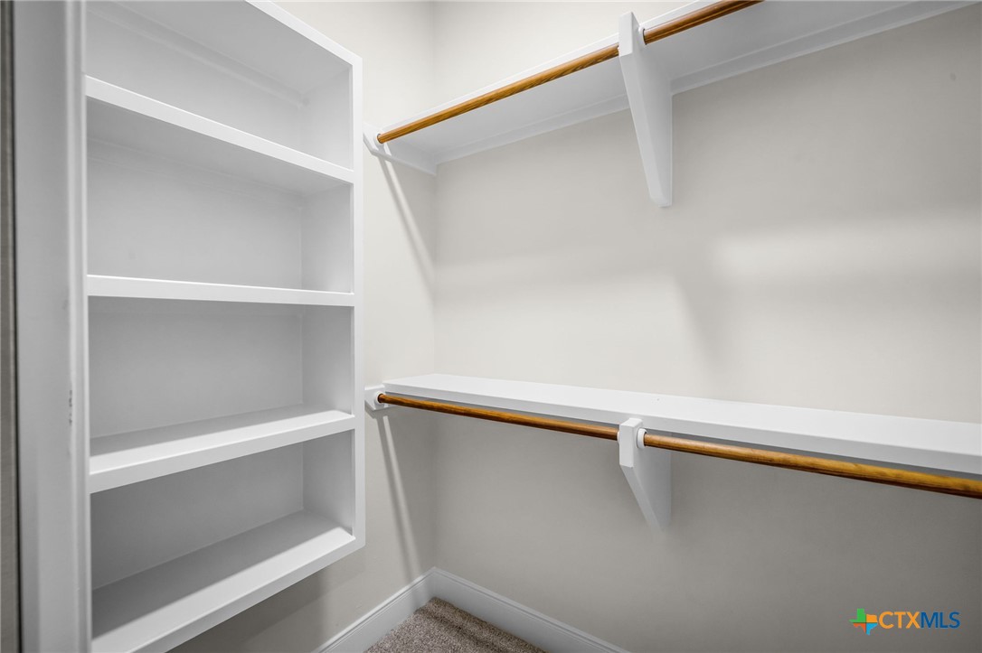 925 River Ranch Circle Martindale, TX 78655 - Photo 35 of 48 a view of walk in closet with empty racks