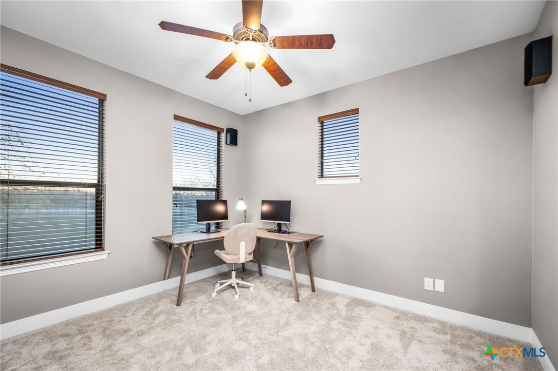 925 River Ranch Circle Martindale, TX 78655 - Photo 36 of 48 a view of a workspace with furniture and a window