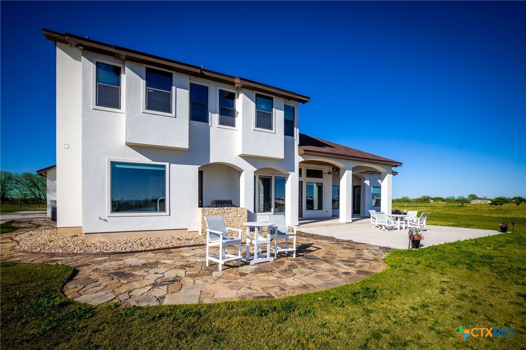 925 River Ranch Circle Martindale, TX 78655 - Photo 9 of 48 a front view of a house with patio