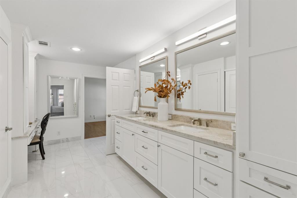 7515 Marquette Street Dallas, TX 75225 - Photo 13 of 25 a bathroom with a granite countertop sink mirror and double