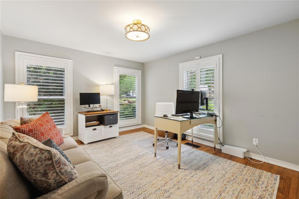 7515 Marquette Street Dallas, TX 75225 - Photo 16 of 25 a living room with furniture and a flat screen tv