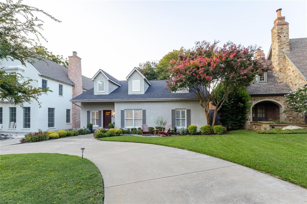 7515 Marquette Street Dallas, TX 75225 - Photo 25 of 25 a front view of house with yard and green space