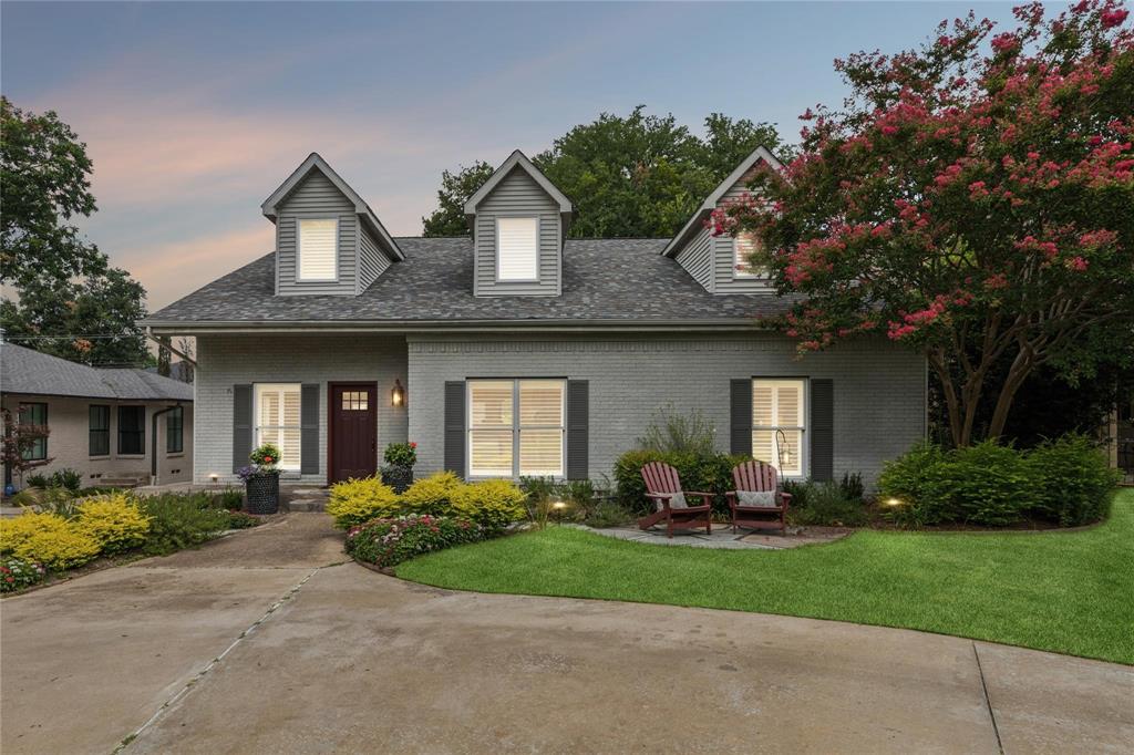 7515 Marquette Street Dallas, TX 75225 - Photo 3 of 25 a front view of a house with a garden and plants