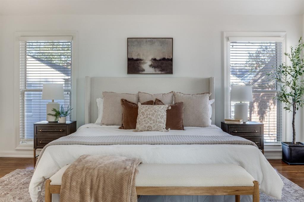 7515 Marquette Street Dallas, TX 75225 - Photo 10 of 25 a large bed sitting in a bedroom next to a window
