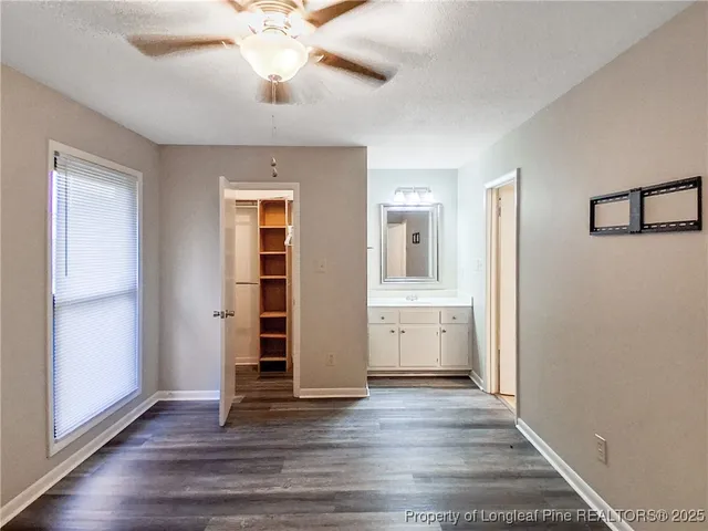 a view of a room with wooden floor and window