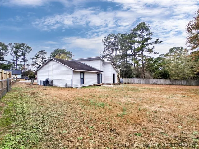 a house with trees in the background