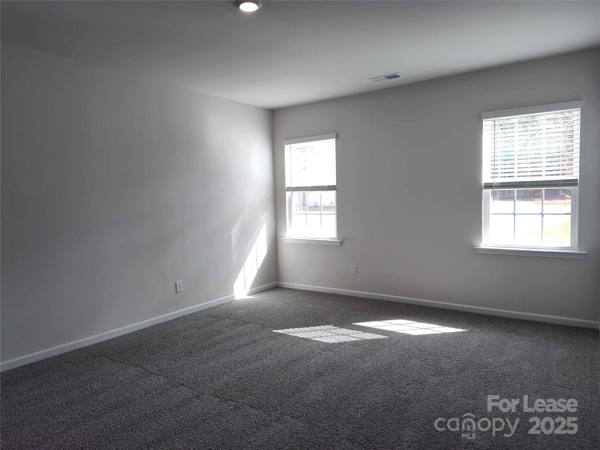 1404 Secrest Cmns Drive Monroe, NC 28112 - Photo 12 of 31 an empty room with windows