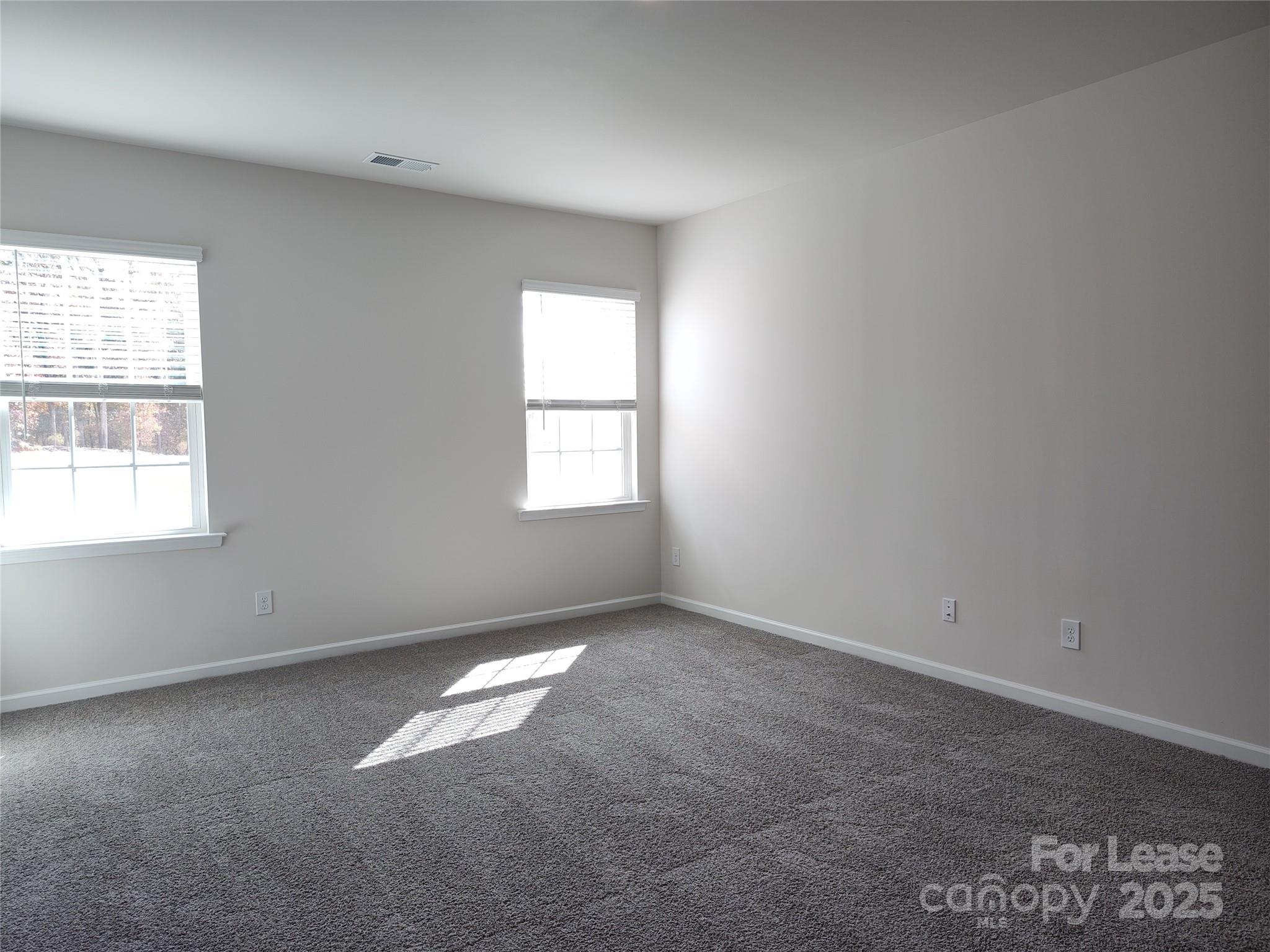1404 Secrest Cmns Drive Monroe, NC 28112 - Photo 13 of 31 an empty room with windows