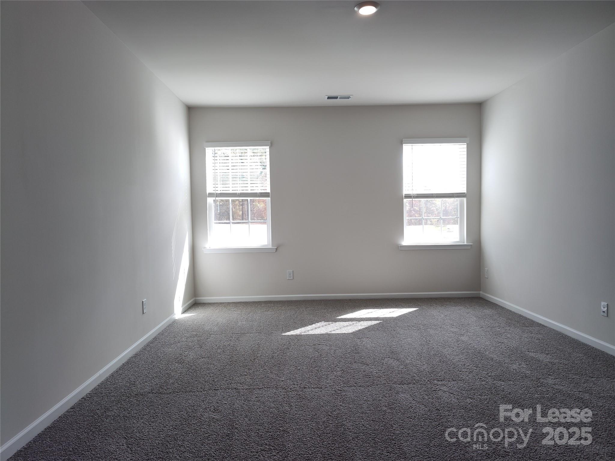 1404 Secrest Cmns Drive Monroe, NC 28112 - Photo 14 of 31 an empty room with windows