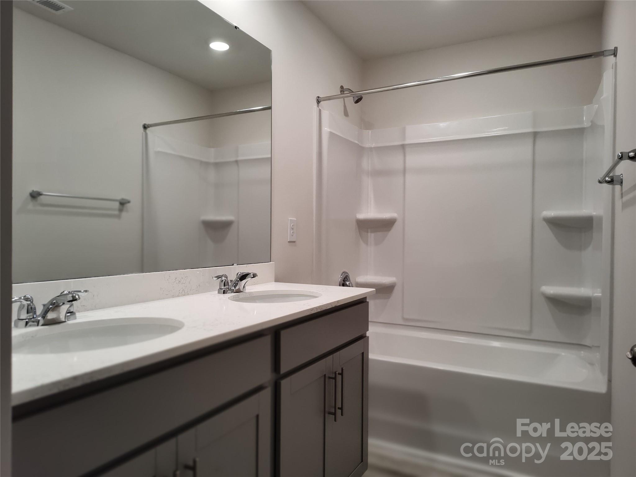 1404 Secrest Cmns Drive Monroe, NC 28112 - Photo 20 of 31 a bathroom with a sink and a mirror