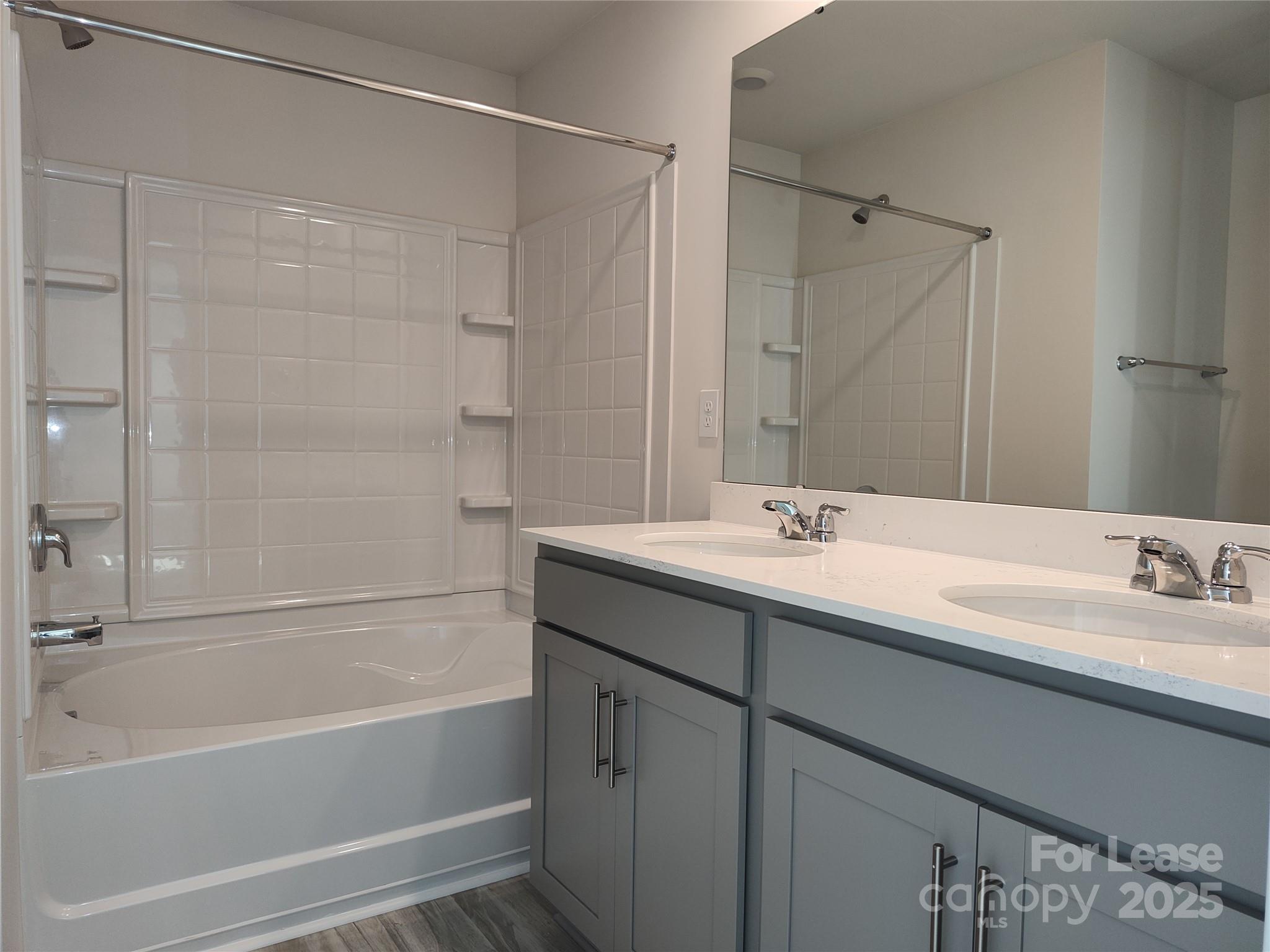 1404 Secrest Cmns Drive Monroe, NC 28112 - Photo 23 of 31 a bathroom with a tub sink shower and mirror