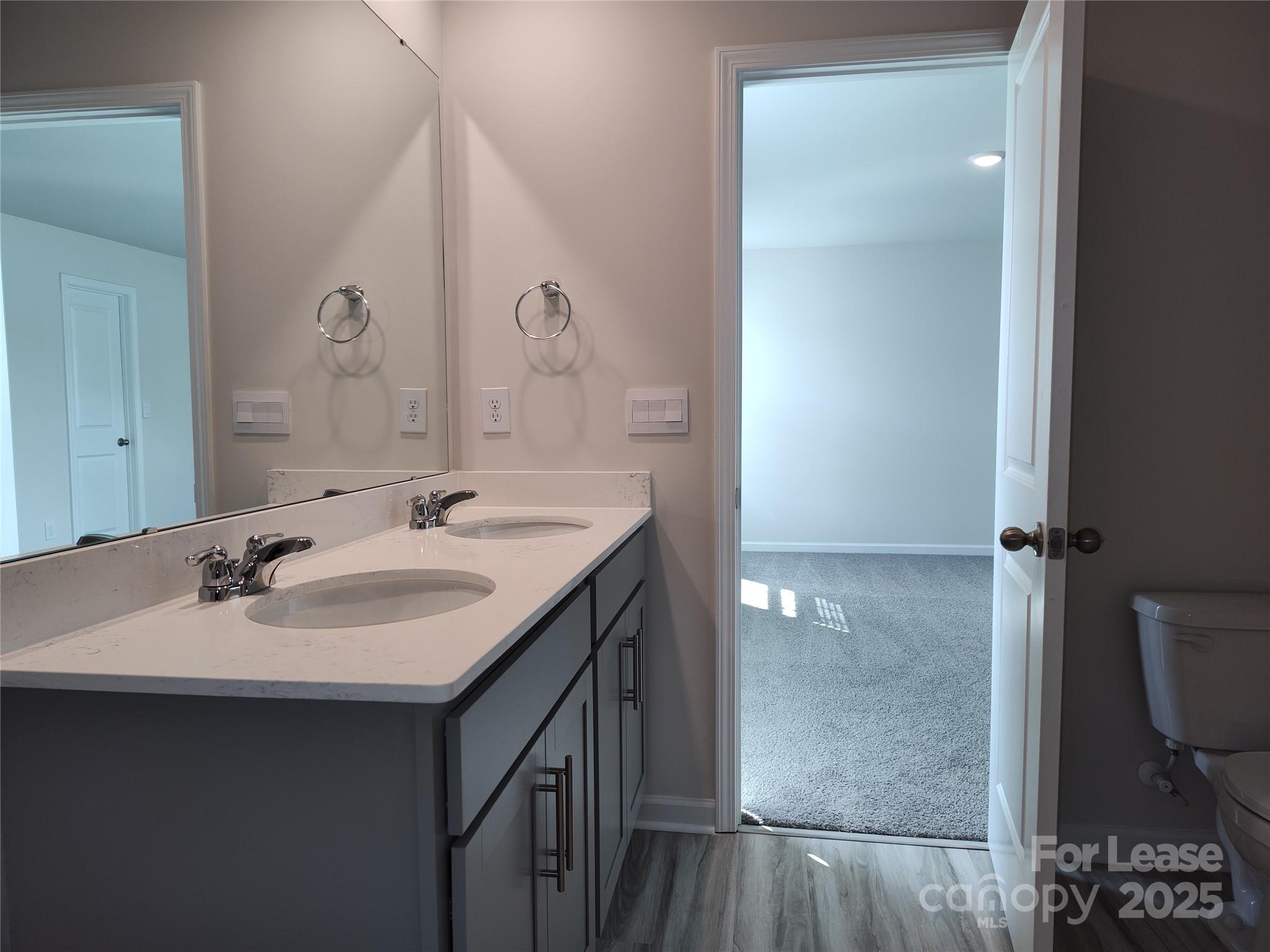 1404 Secrest Cmns Drive Monroe, NC 28112 - Photo 24 of 31 a bathroom with a sink and a mirror