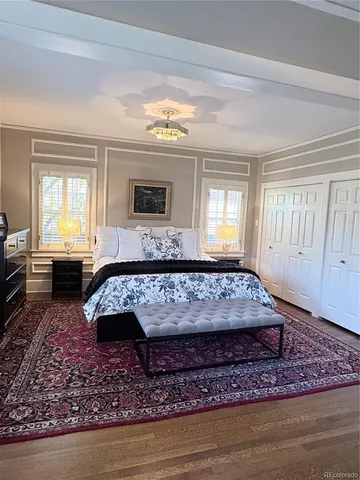 a living room with a couch and a rug