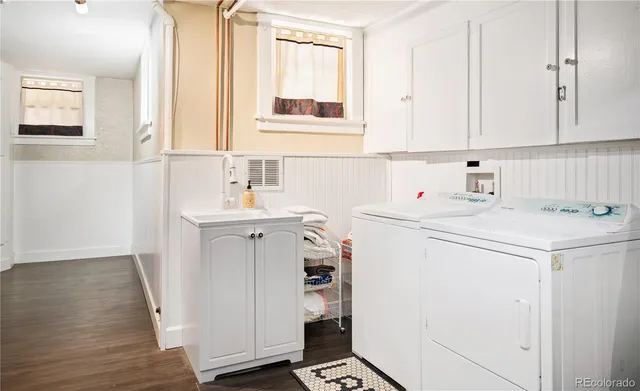 a utility room with closet dryer and washer
