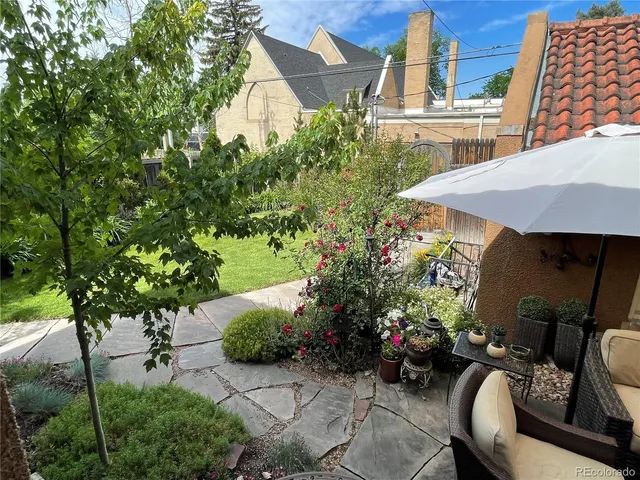 a view of a chairs and table in the patio