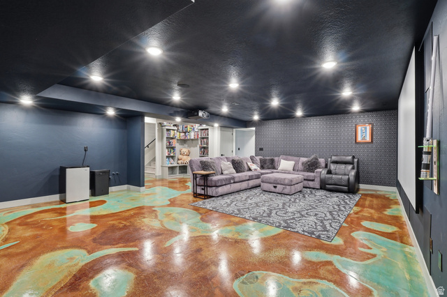 175 North 100 West Providence, UT 84332 - Photo 23 of 45 Home theater room featuring concrete floors and wallpapered walls