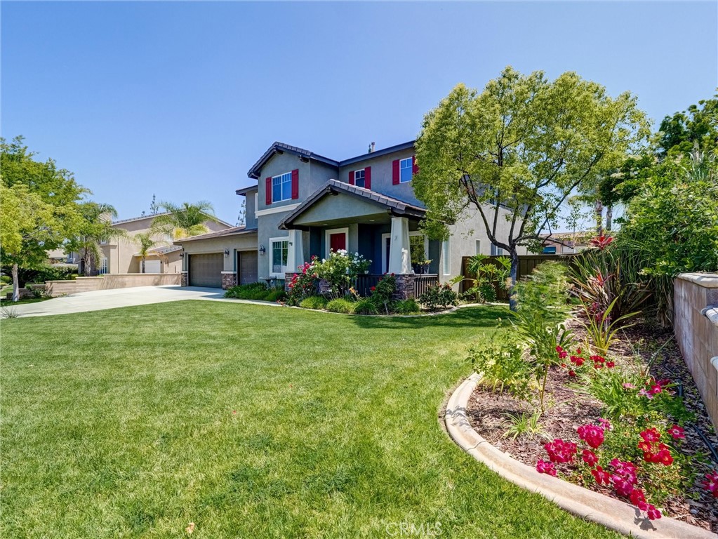 8242 Daisy Lane Riverside, CA 92508 - Photo 1 of 1 a front view of a house with a yard