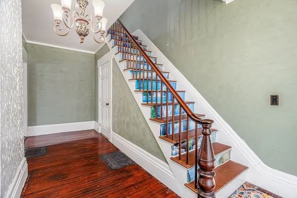 a view of entryway with wooden floor
