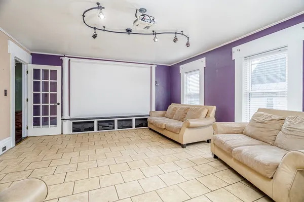 a living room with furniture and window