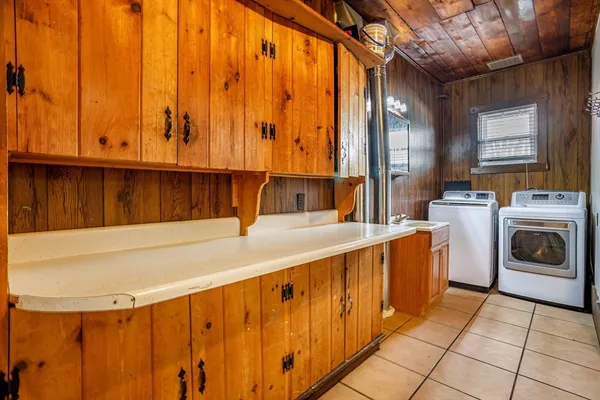 a bathroom with a sink a washer and dryer