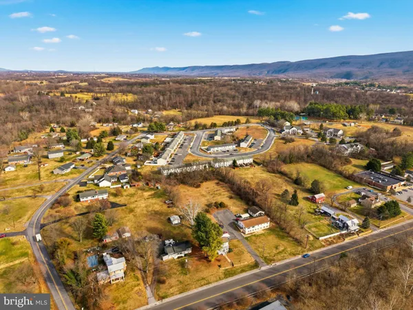 an aerial view of residential building and ocean view