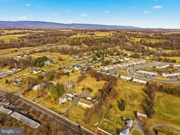 an aerial view of residential building and ocean