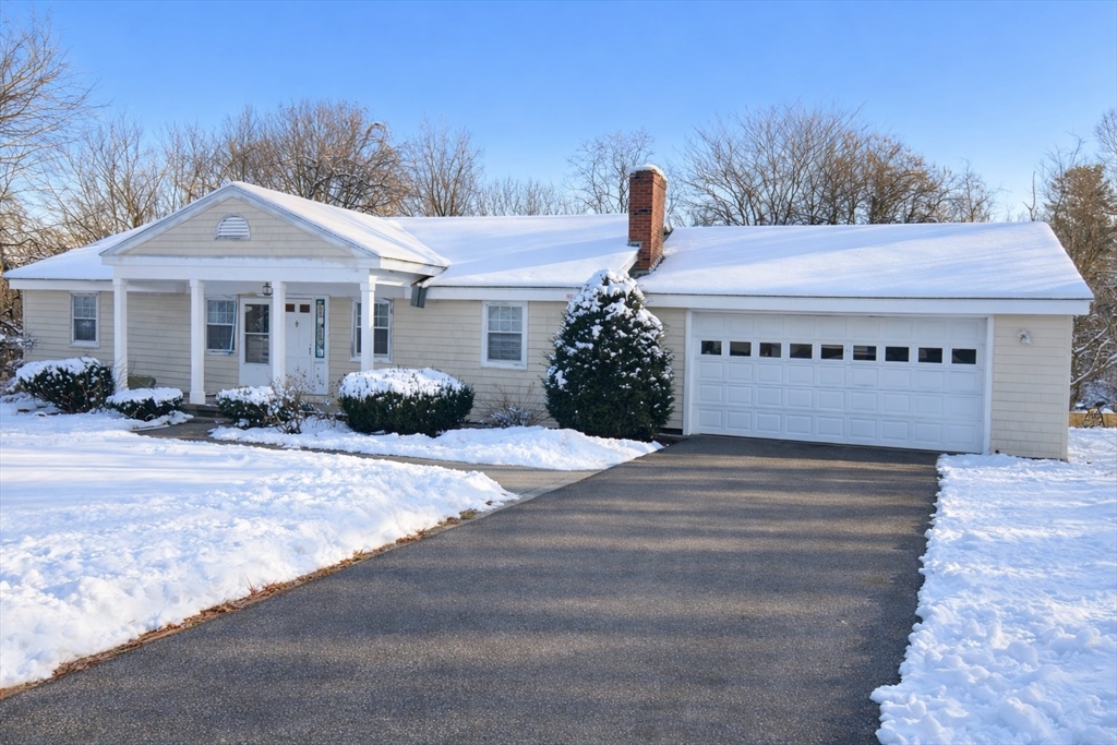 369 Berlin Road Marlborough, MA 01752 - Photo 1 of 12 a front view of a house with a garden