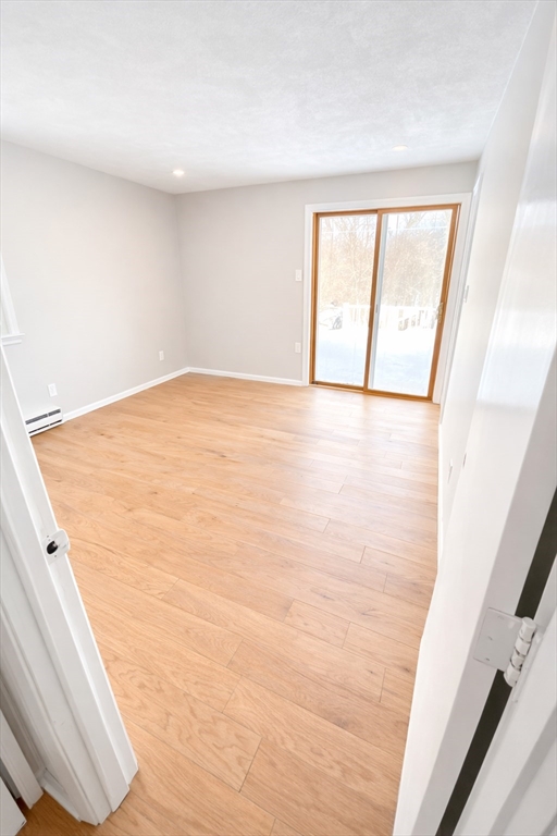 369 Berlin Road Marlborough, MA 01752 - Photo 3 of 12 a view of an empty room and window