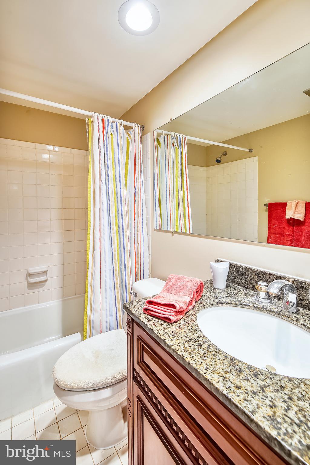 10026 Stedwick Road, Unit 301 Gaithersburg, MD 20886 - Photo 17 of 24 UPDATED BATH WITH CHERRY VANITY W/GRANITE