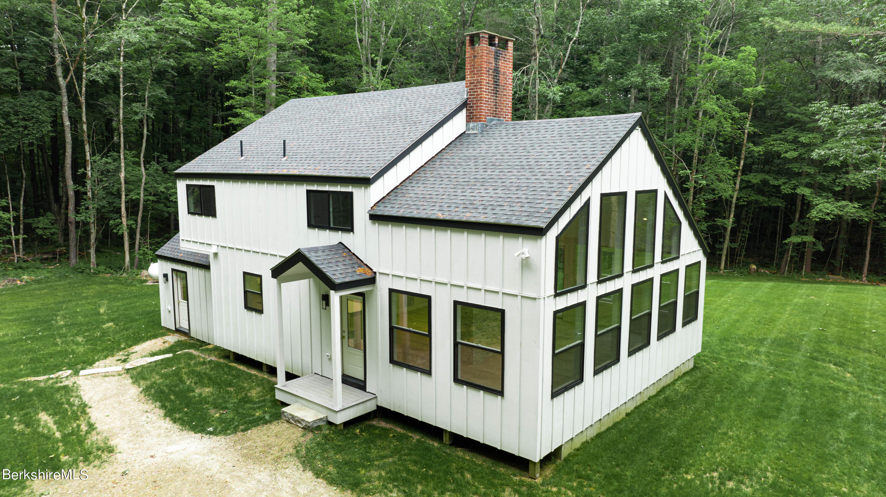 220 Hupi Road Monterey, MA 01245 - Photo 1 of 38 a view of a house with backyard