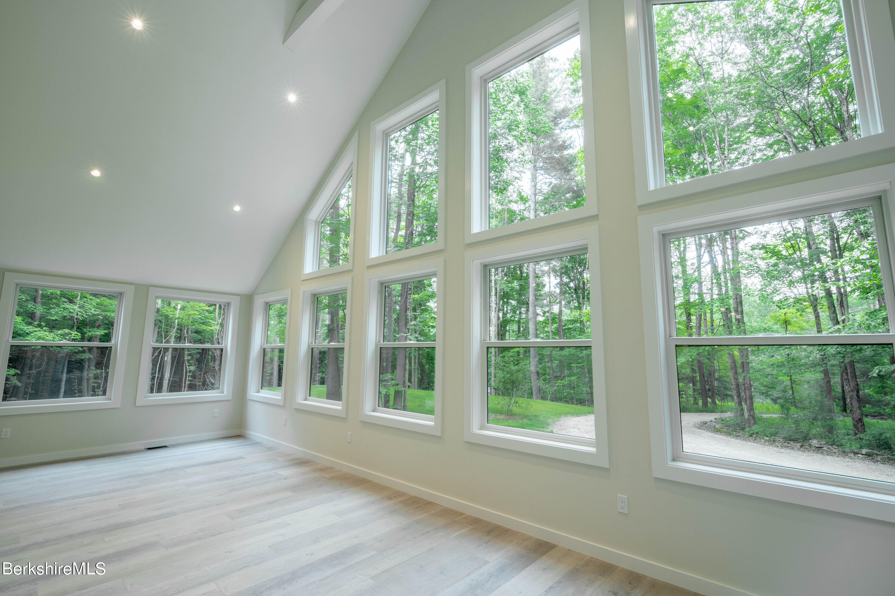 220 Hupi Road Monterey, MA 01245 - Photo 14 of 38 a view of an empty room with wooden floor and a window