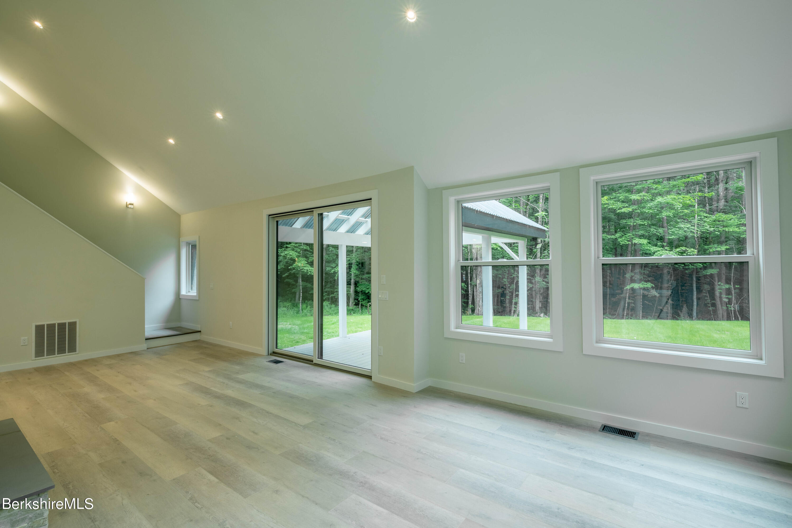 220 Hupi Road Monterey, MA 01245 - Photo 22 of 38 a view of an empty room with glass door and balcony