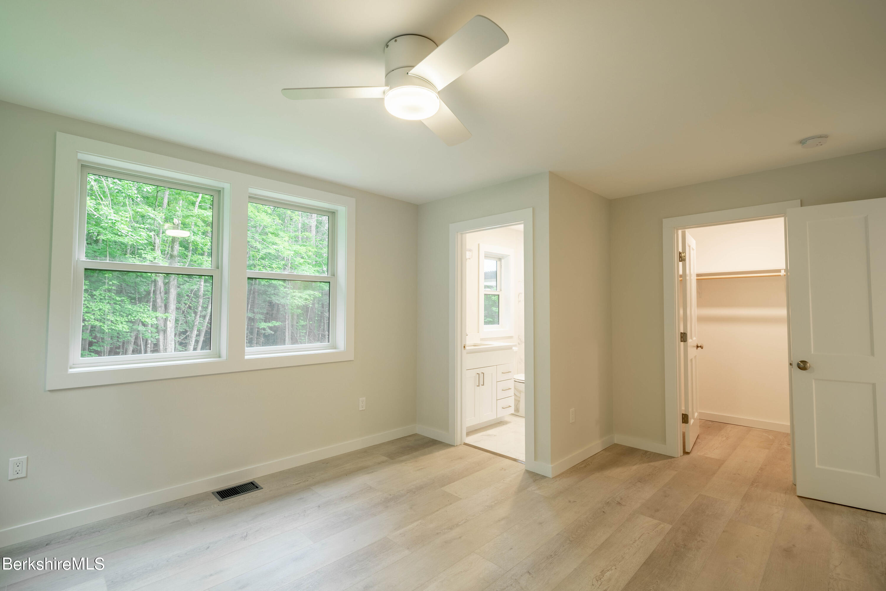 220 Hupi Road Monterey, MA 01245 - Photo 25 of 38 an empty room with windows and fan