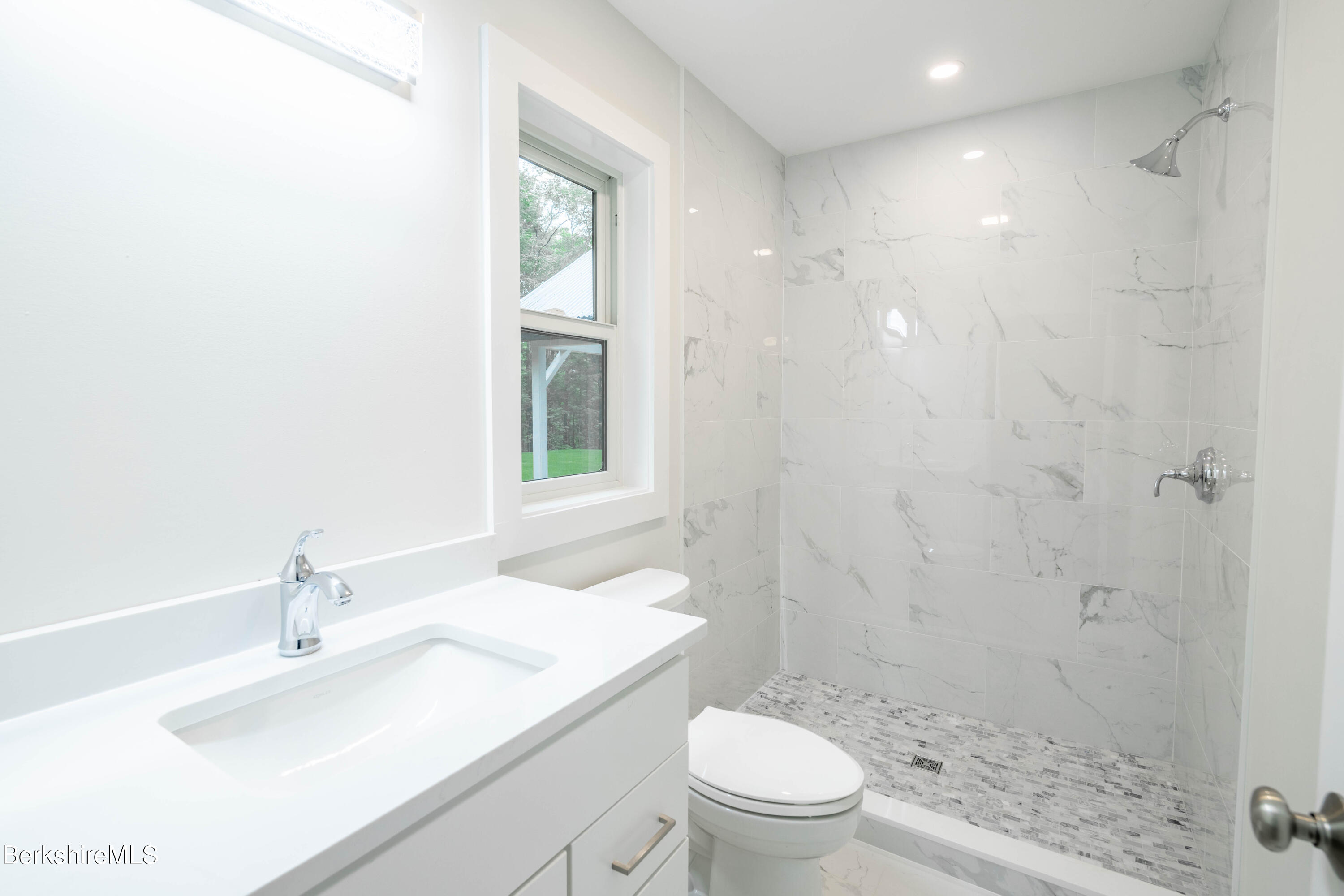 220 Hupi Road Monterey, MA 01245 - Photo 26 of 38 a bathroom with a sink toilet vanity and shower