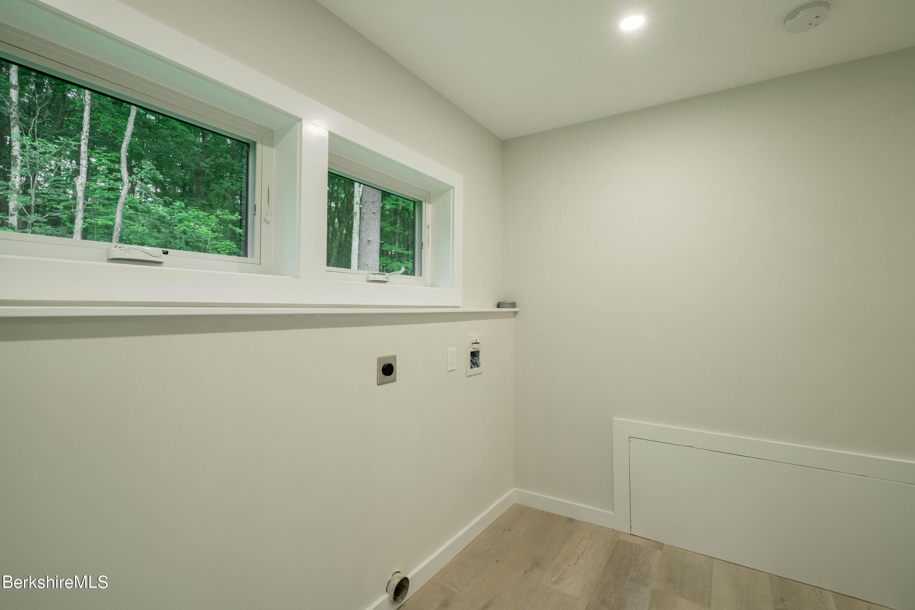 220 Hupi Road Monterey, MA 01245 - Photo 27 of 38 a view of a small space with wooden floor and a window